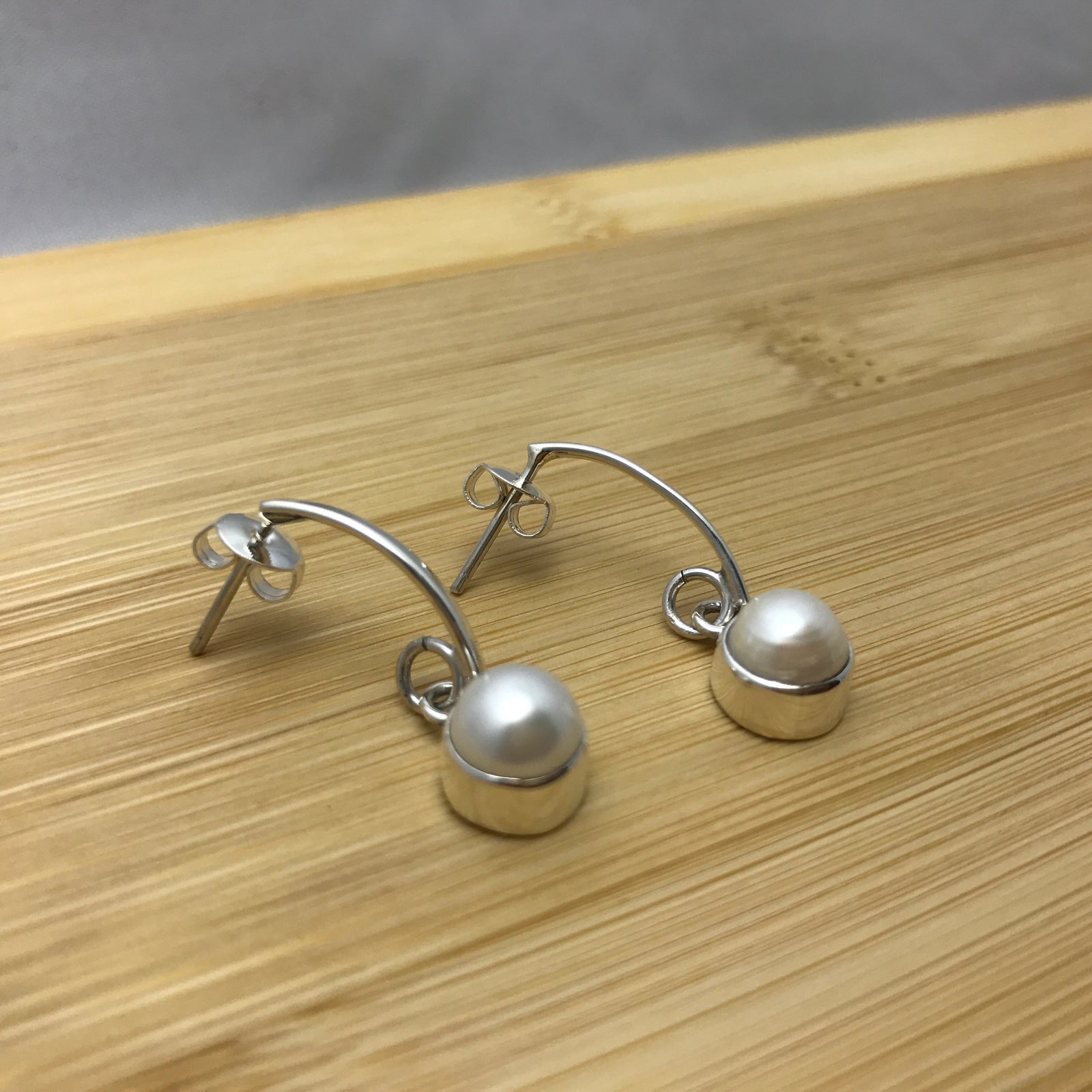 Single Pearl Arc Silver Earrings