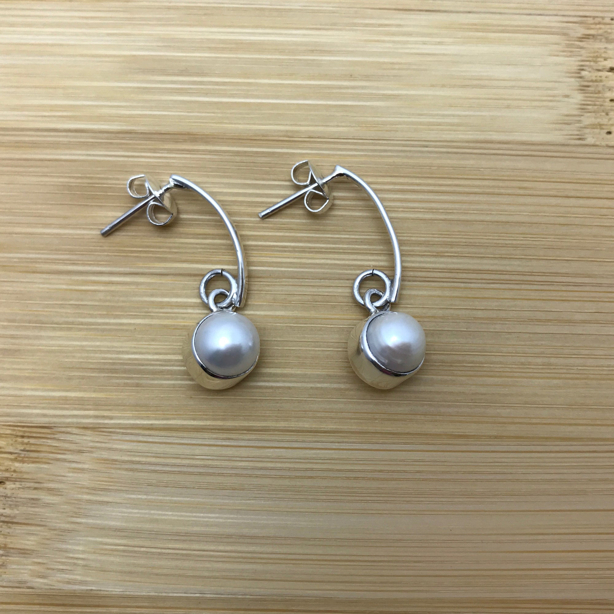 Single Pearl Arc Silver Earrings